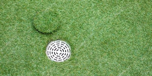 Artificial grass and a drainage hole