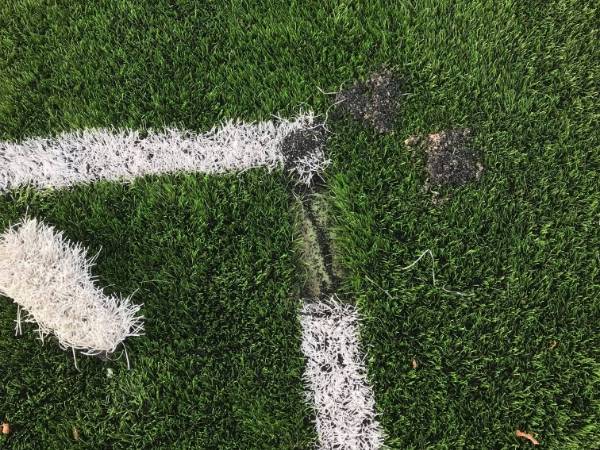 A worn spot on the artificial grass