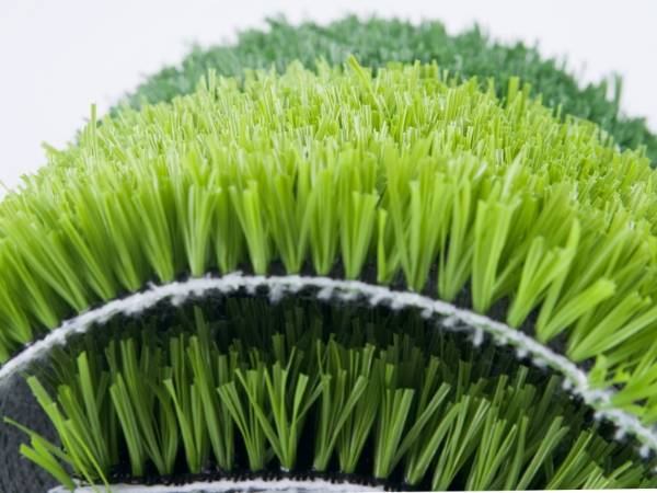 A roll of half unfolded artificial grass