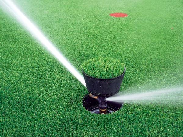 Artificial grass is taking a small shower.
