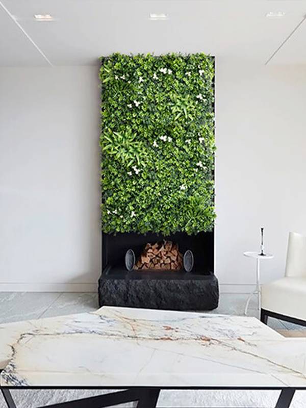 Artificial plant wall is placed in the office.