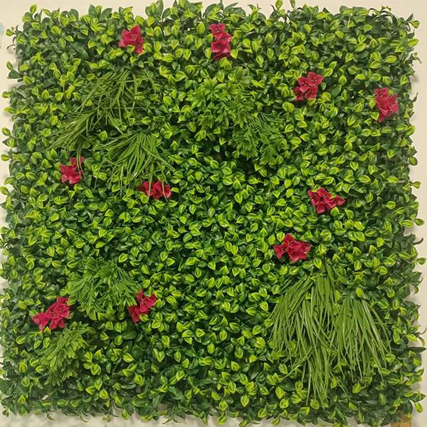 Artificial plant wall with many red flowers