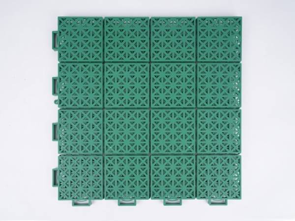 A green type-3 interlocking sports flooring tile