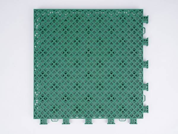 A green type-4 interlocking sports flooring tile