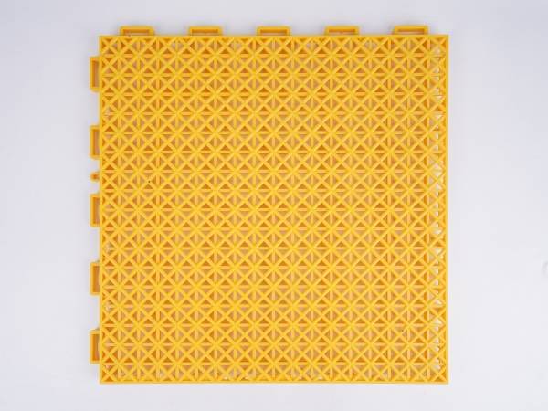 A yellow type-5 interlocking sports flooring tile