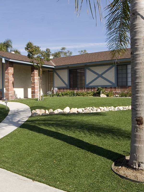 Residential landscape artificial turf laid in front of the house