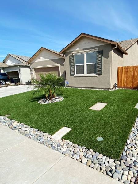 A house laid with landscape artificial turf