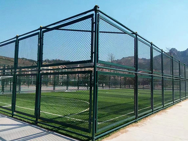 Surrounding chain link fence installed around the sports field