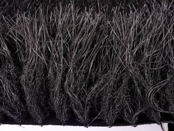 A piece of gray synthetic thatch grass